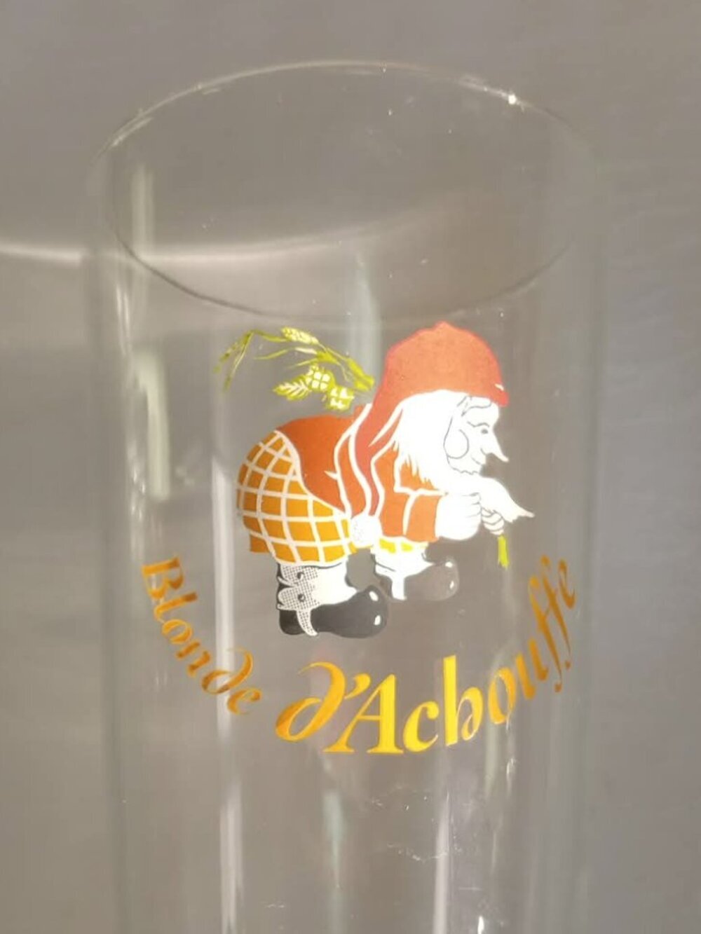 Beer glass from the Belgian brewery Achouffe with the brewery's logo